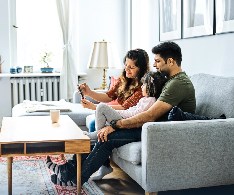 Family relaxing at home with comfortable air conditioning